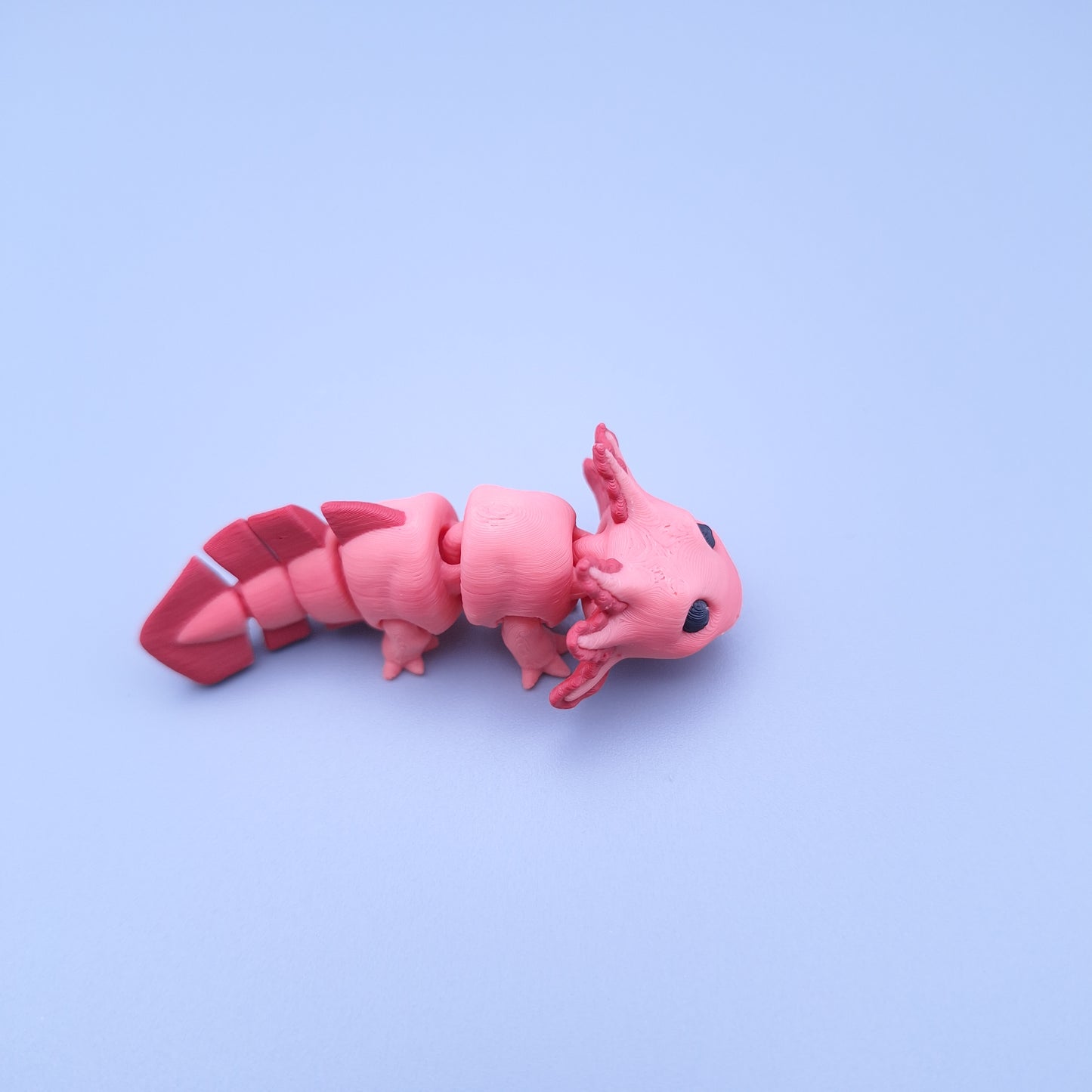Mini axolotl fidget keychain with articulated tail and frilly gills