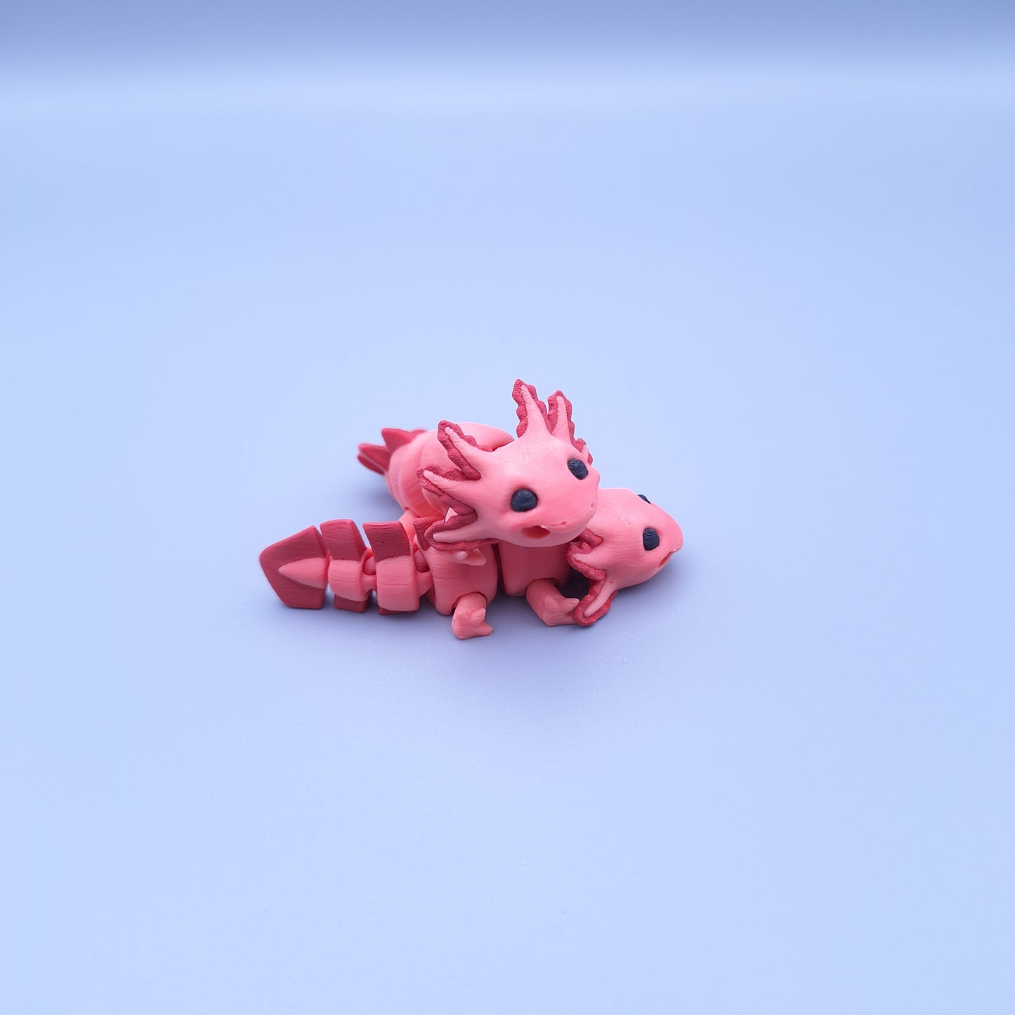 Mini axolotl fidget keychain with articulated tail and frilly gills