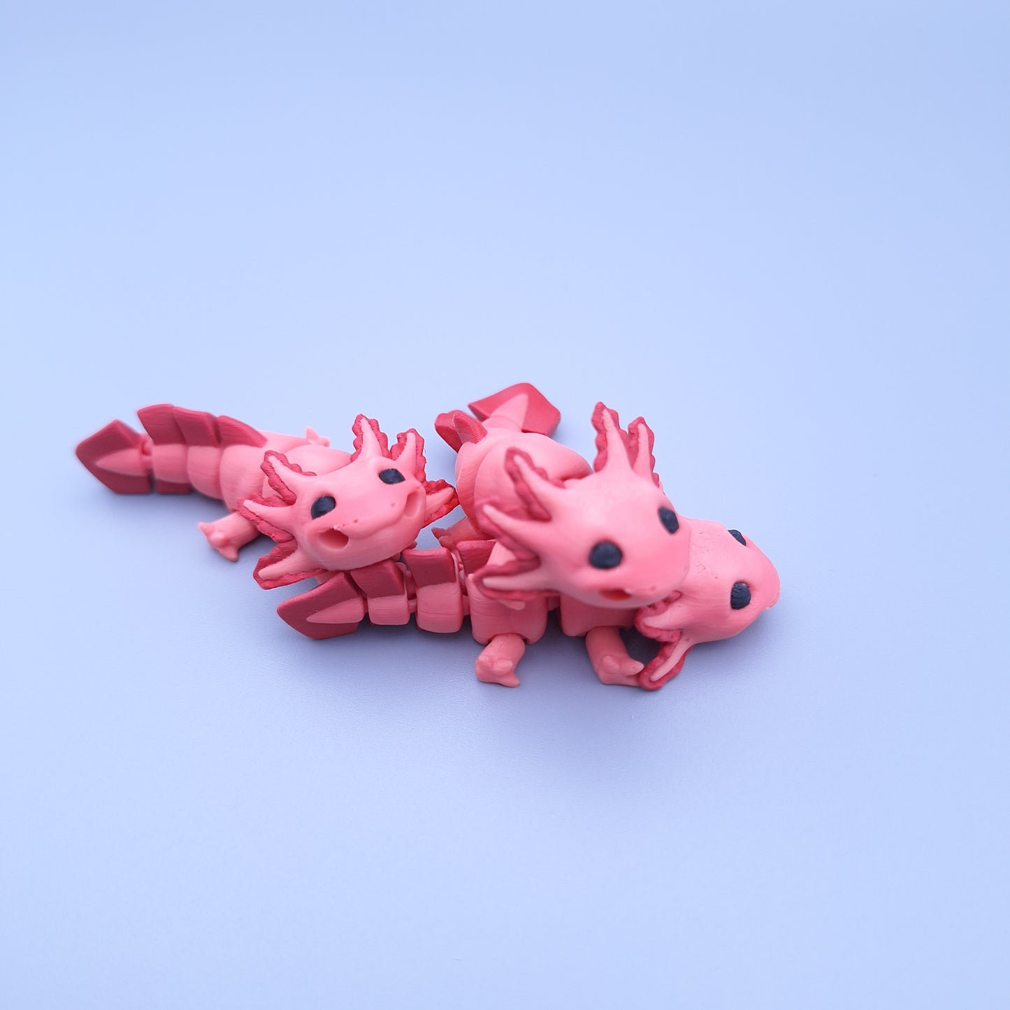Mini axolotl fidget keychain with articulated tail and frilly gills