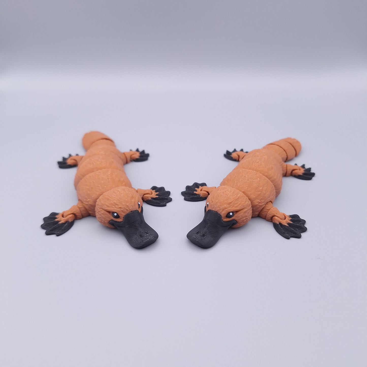 Realistic articulated platypus fidget toy with wide bill and sculpted limbs