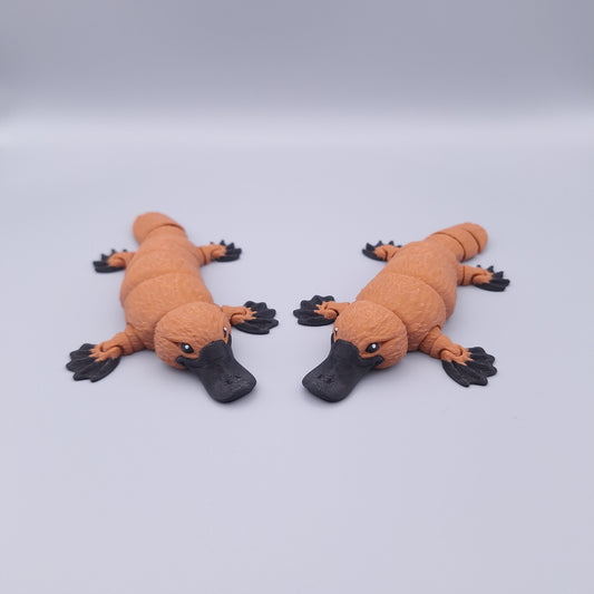 Realistic articulated platypus fidget toy with wide bill and sculpted limbs