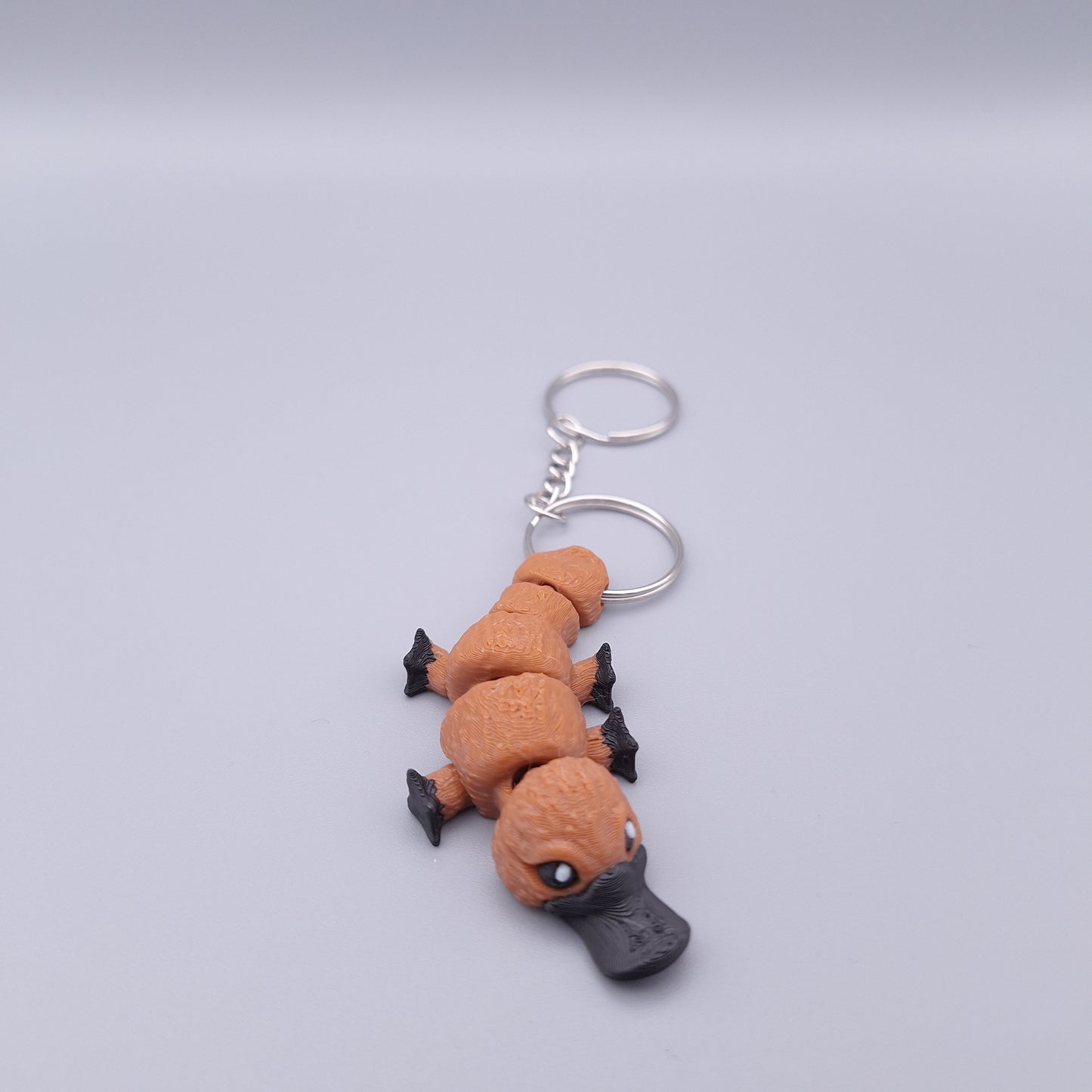 Mini platypus fidget keychain with flappy limbs and round body
