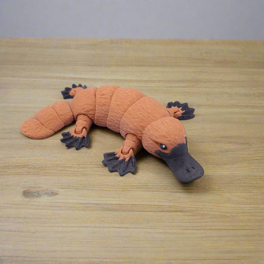 Realistic articulated platypus fidget toy with wide bill and sculpted limbs