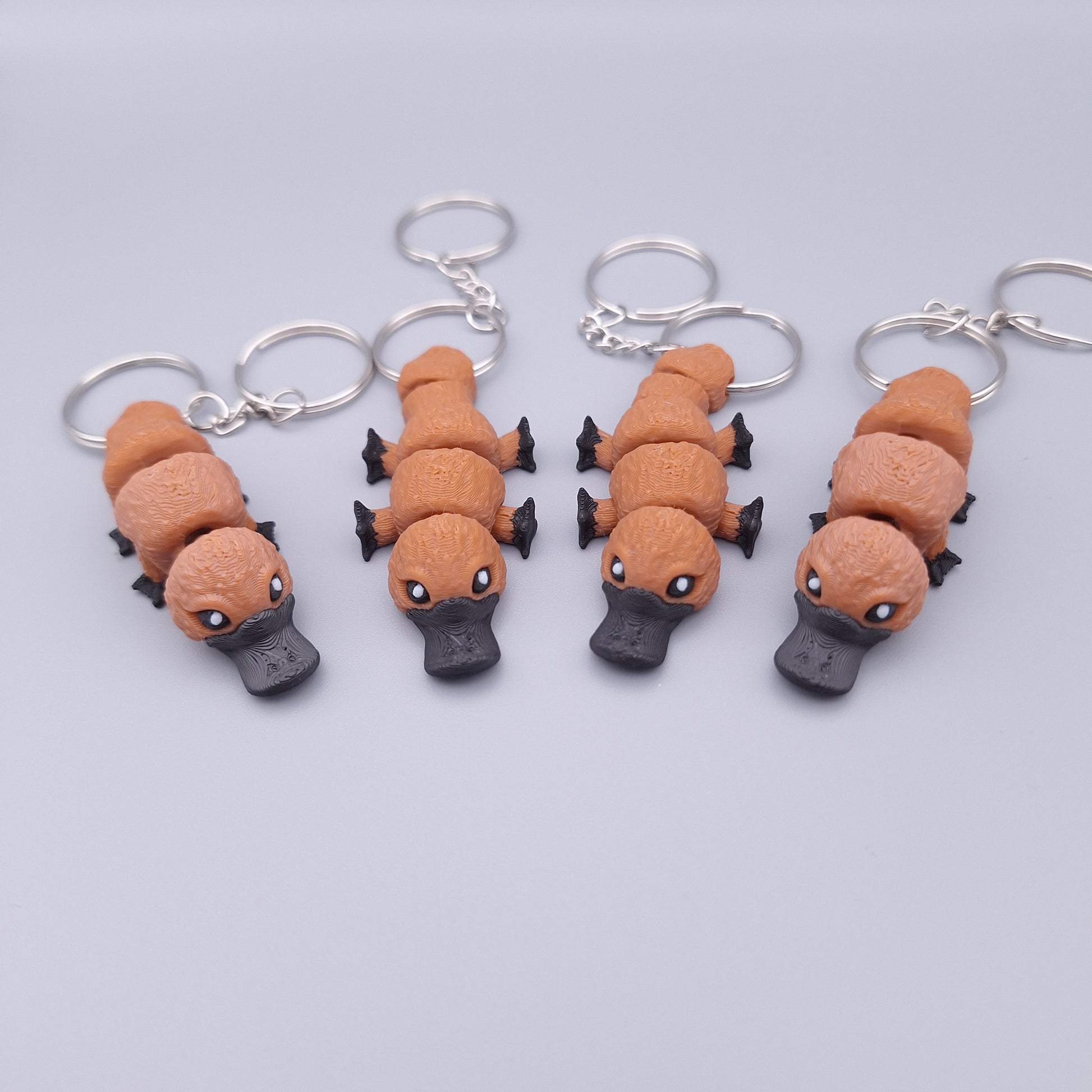 Mini platypus fidget keychain with flappy limbs and round body