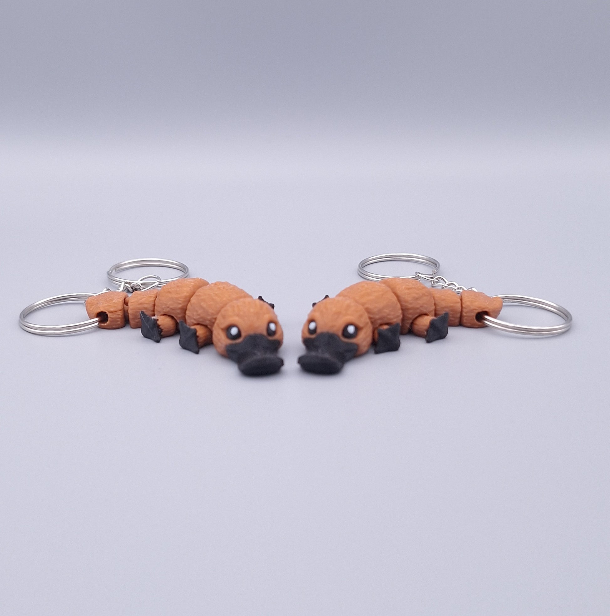 Mini platypus fidget keychain with flappy limbs and round body